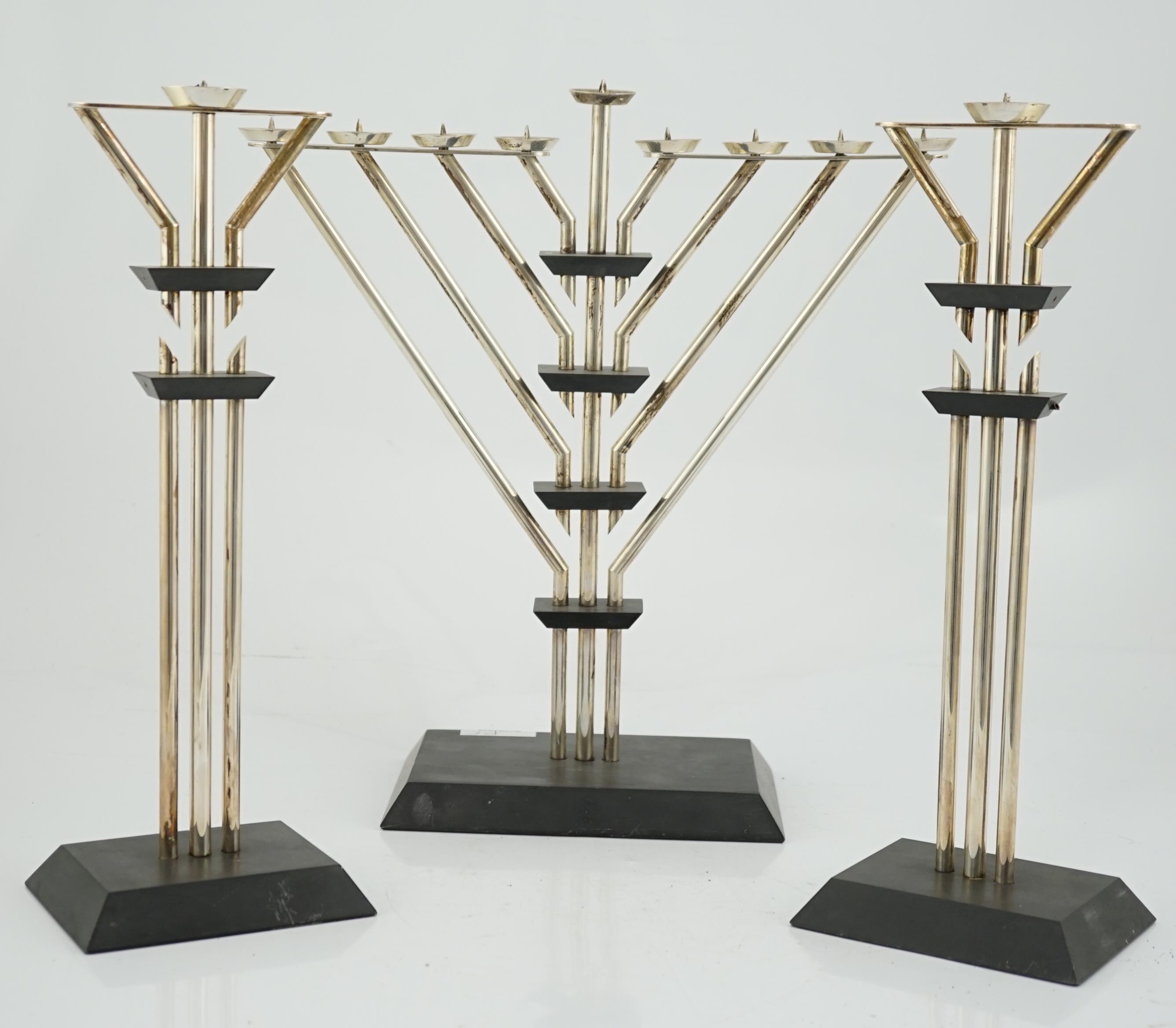 An Elizabeth II silver mounted slate Hanukkah Menorah and a pair of matching candlesticks by Marianne Forest